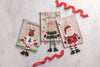 Mud Pie - Christmas Tea Towel - Dangle Leg